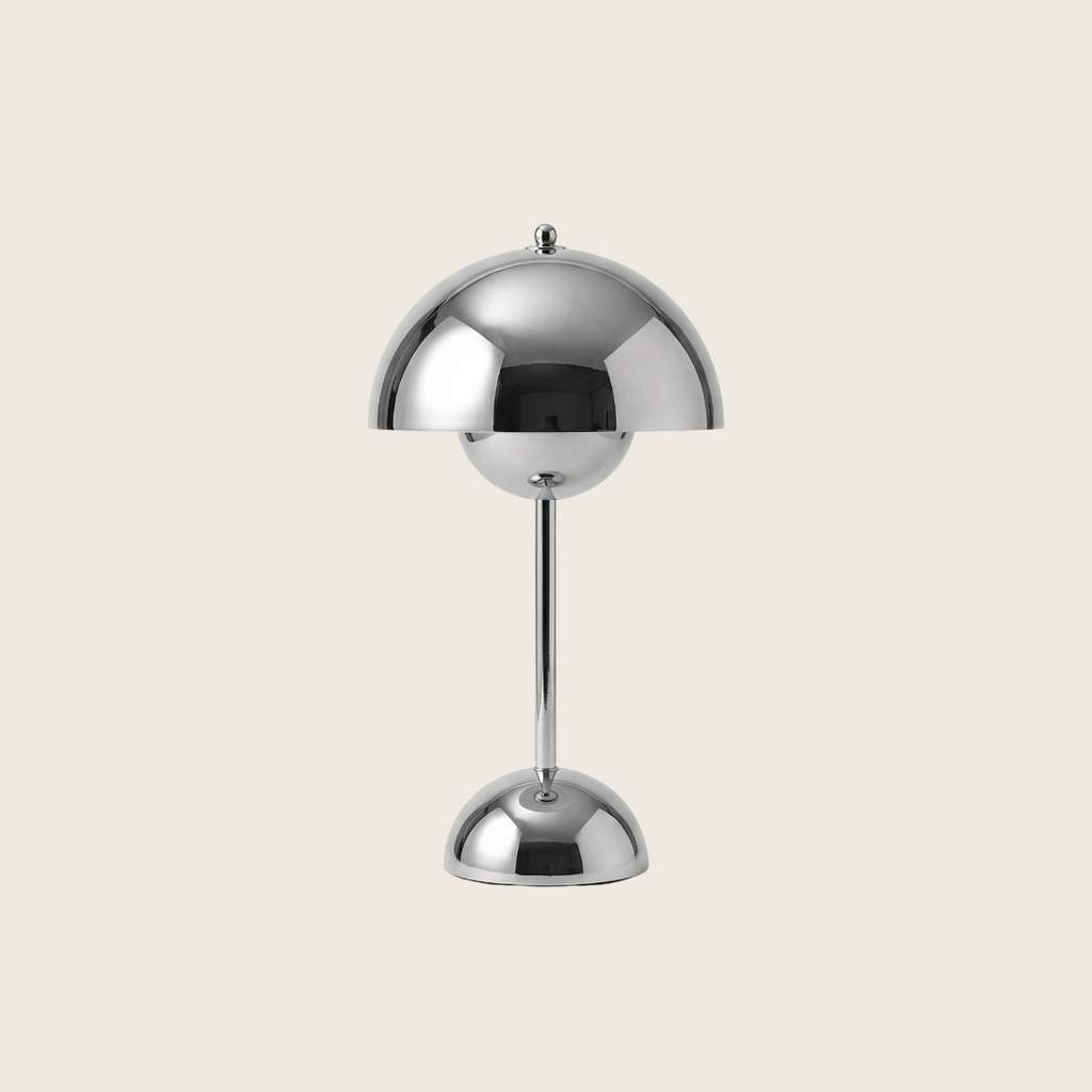 Chrome table lamp on a light gray background