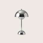 Chrome table lamp on a light gray background