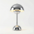 Modern chrome desk lamp on a white background